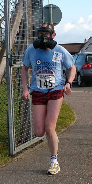 Andy McMahon running in gas mask at the 2012 Lossiemouth half marathon - new world record